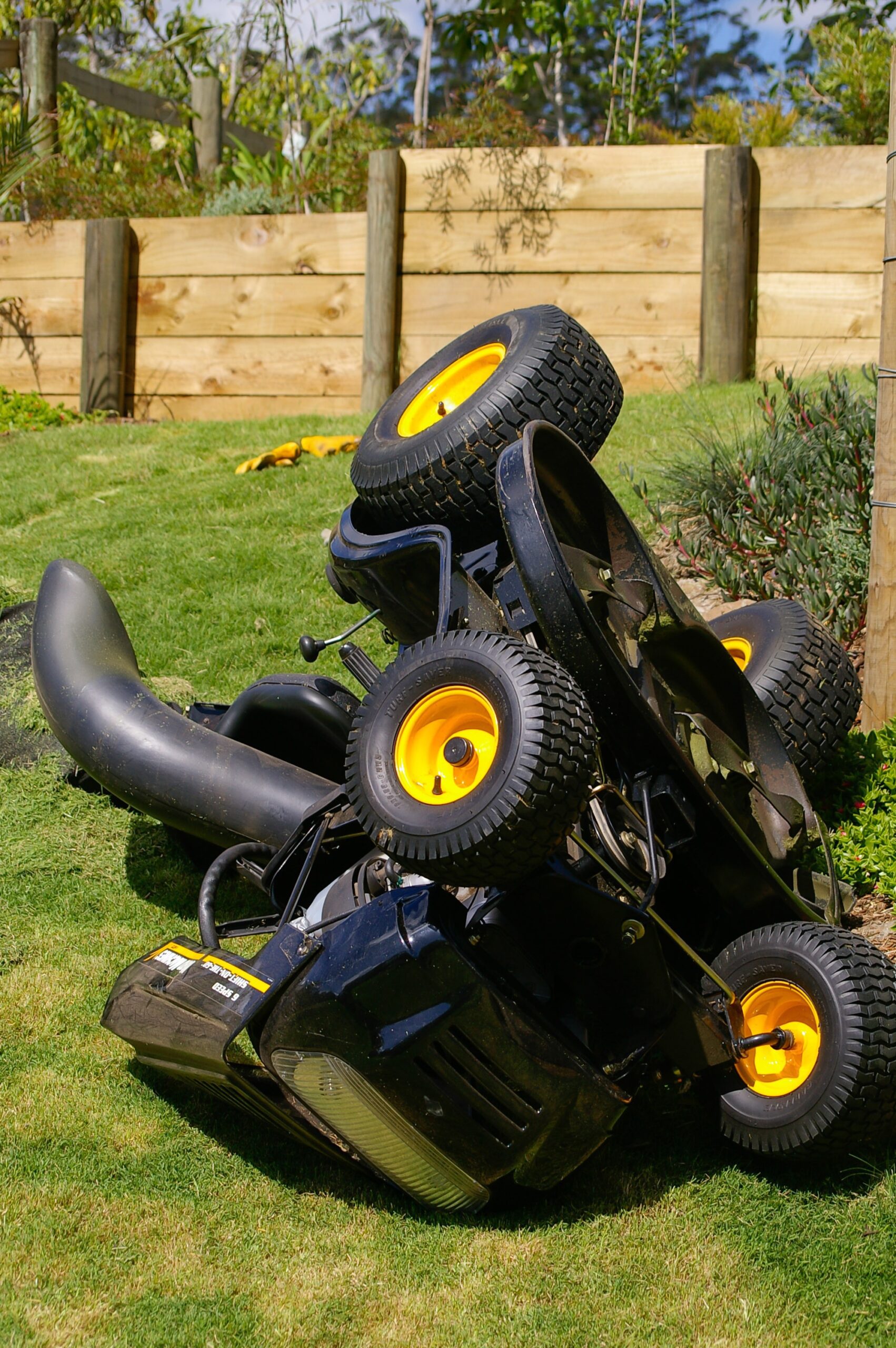 A Lawn Mower on its back to show the Blades